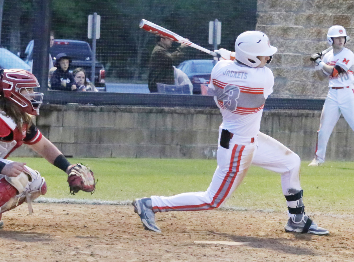 Brady Shrum drives a two-RBI single to center to give Mineola the lead in the sixth against Harmony.